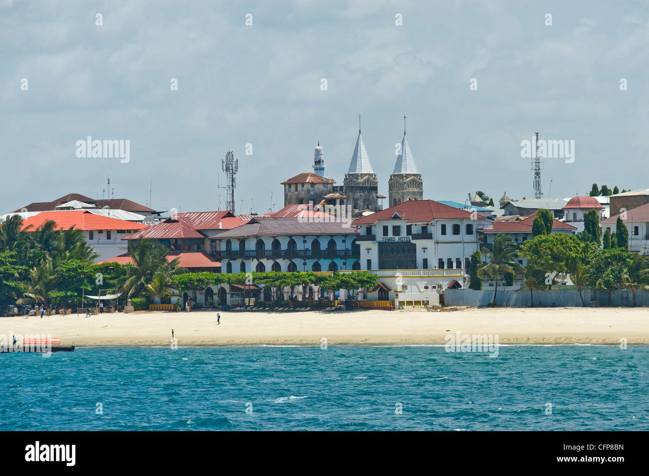 Tembo Hotel and towers of Anglican Cathedral in Stone Town Zanzibar Tanzania Stock Photo