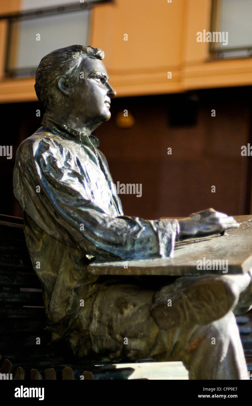 A statue of a man reading on a sunny day in Palamos, Costa Brava. Stock Photo