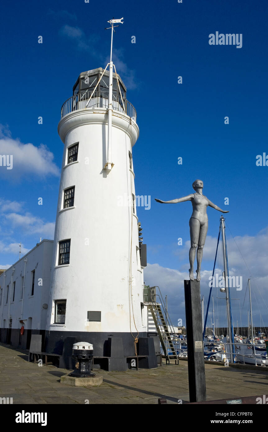 Figure of the Diving Belle next to the Lighthouse in winter Scarborough North Yorkshire England UK United Kingdom GB Great Britain Stock Photo
