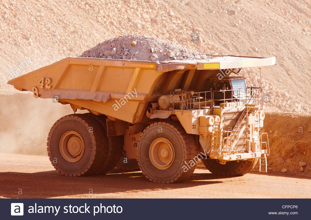 CAT 793 (?) mine haul truck 240 tons nominal capacity driver Stock