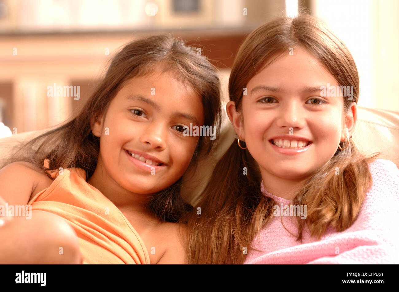 Close-up of Girls on Couch Stock Photo