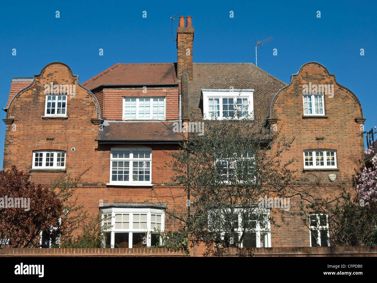 semidetached houses in bedford park, london, england, with architectural features typical of
