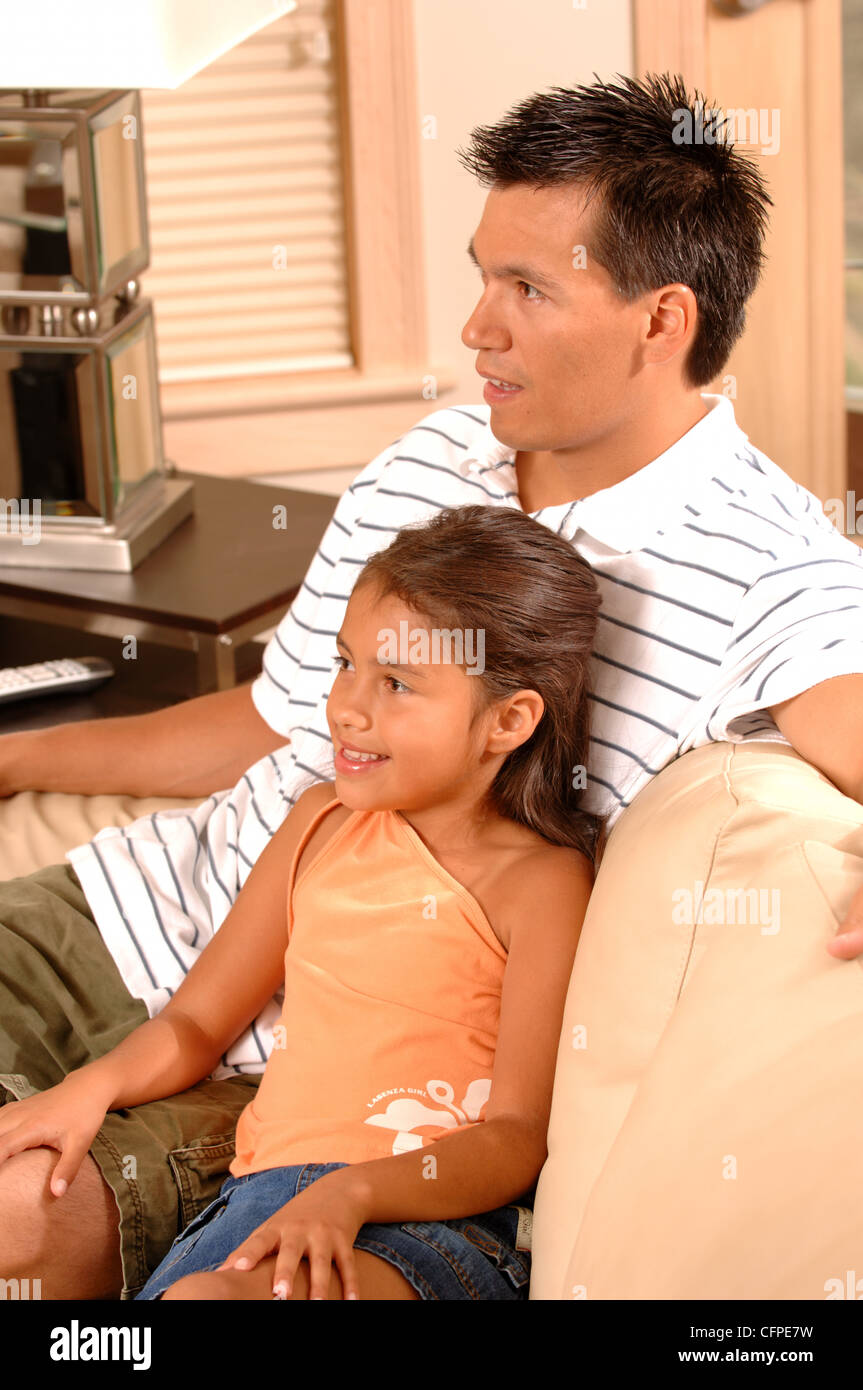 Father and Daughter on Couch Stock Photo