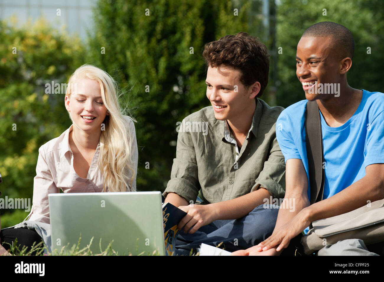 University students spending time together outdoors Stock Photo
