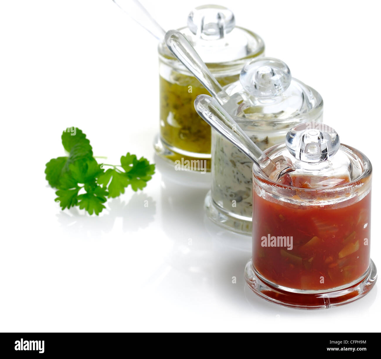 Salsa And Dips Assortment In Glass Jars Stock Photo