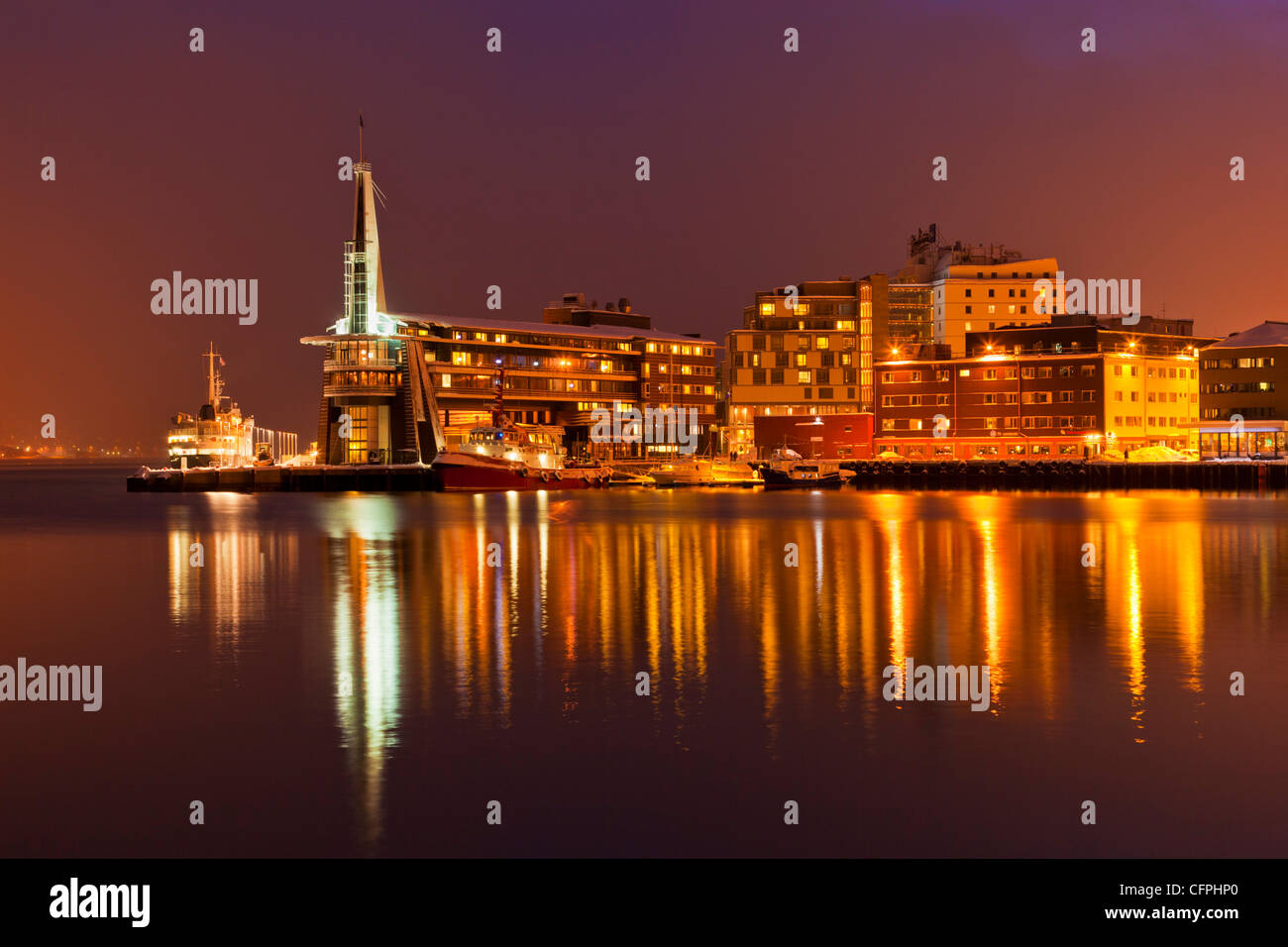 Arctic city of Tromso, harbour, port and waterfront warehouses at night, Tromso, Troms, North Norway, Europe Stock Photo