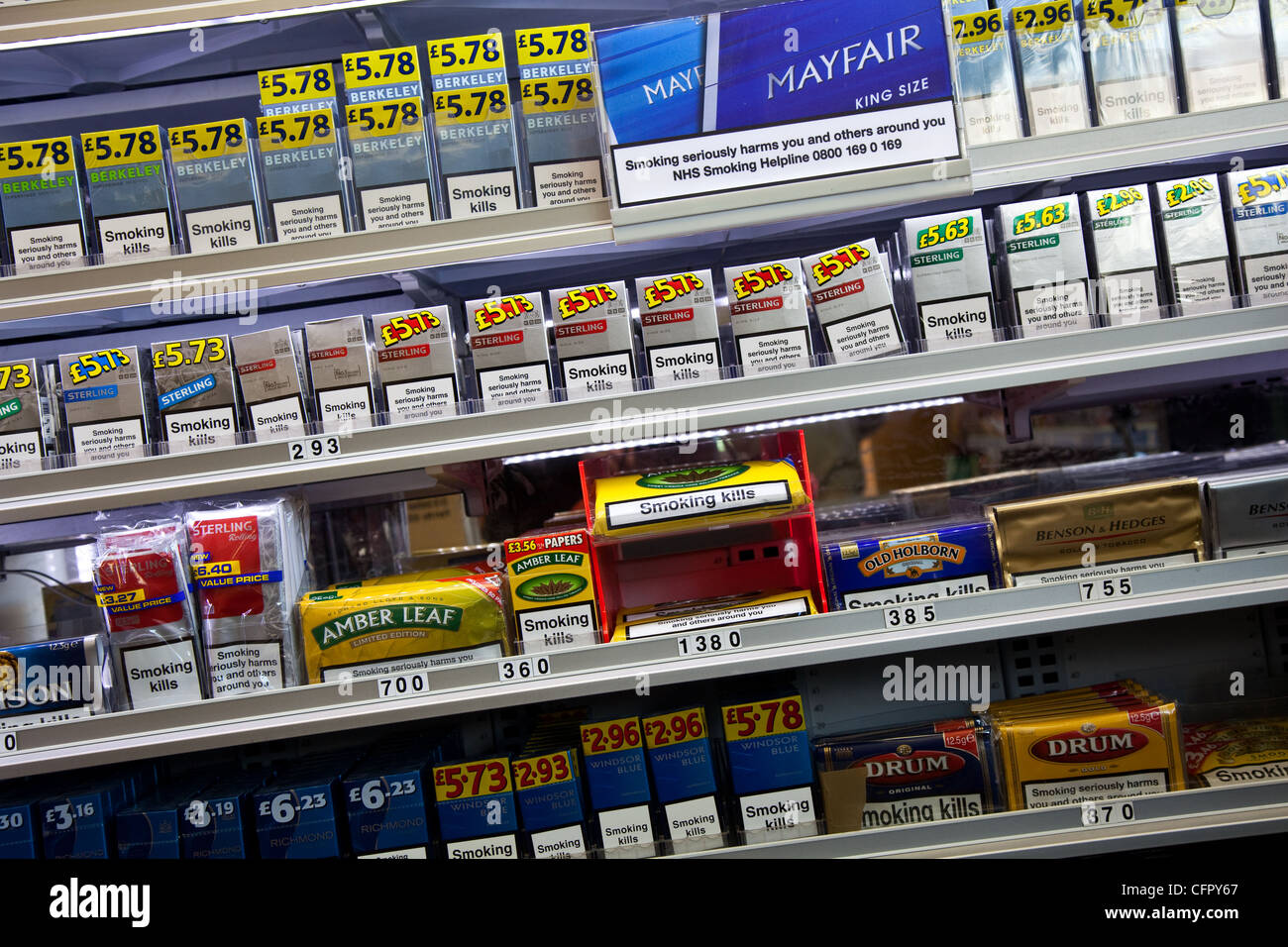 Point of sale cigarettes and Tobacco for sale   2012 Shop Display of cigarette packets of priced smoking products, UK Stock Photo