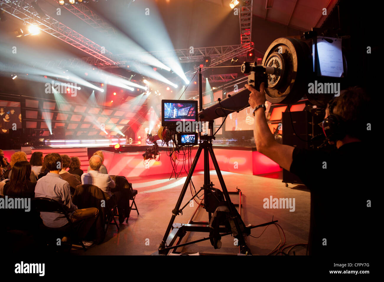 Cameraman with camera on jib and audience at the broadcasting a live