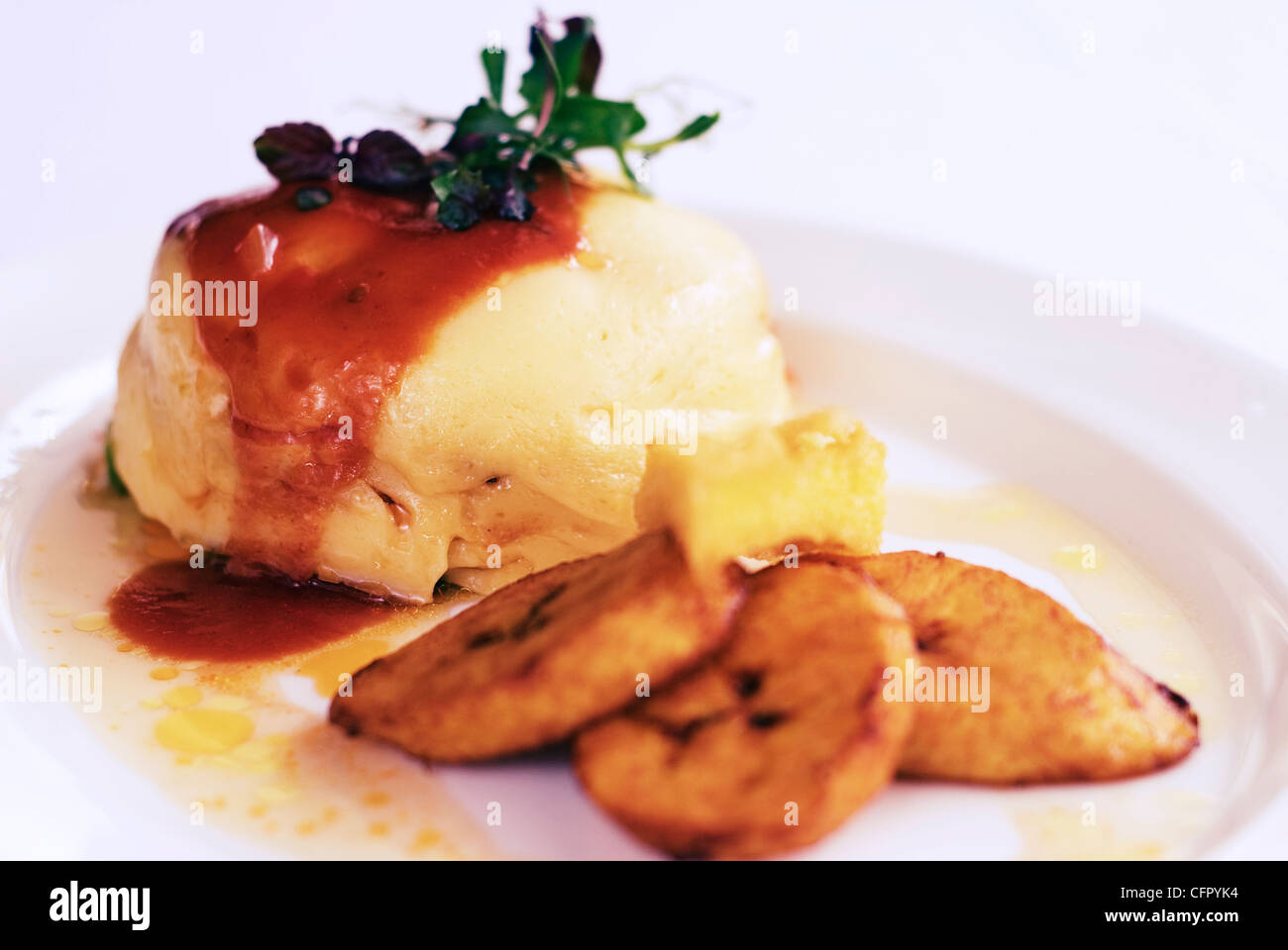 Keshi Yena, a traditional dish from Curaçao, consists of cheese filled with meat or chicken, vegetables and spices. Stock Photo