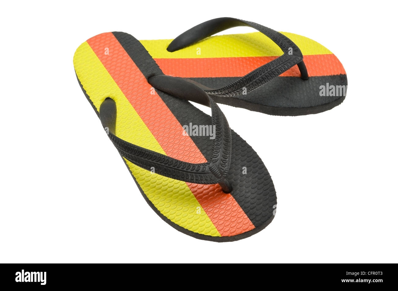 A pair of flip-flops printed with the colours of the national flag of Germany. Stock Photo