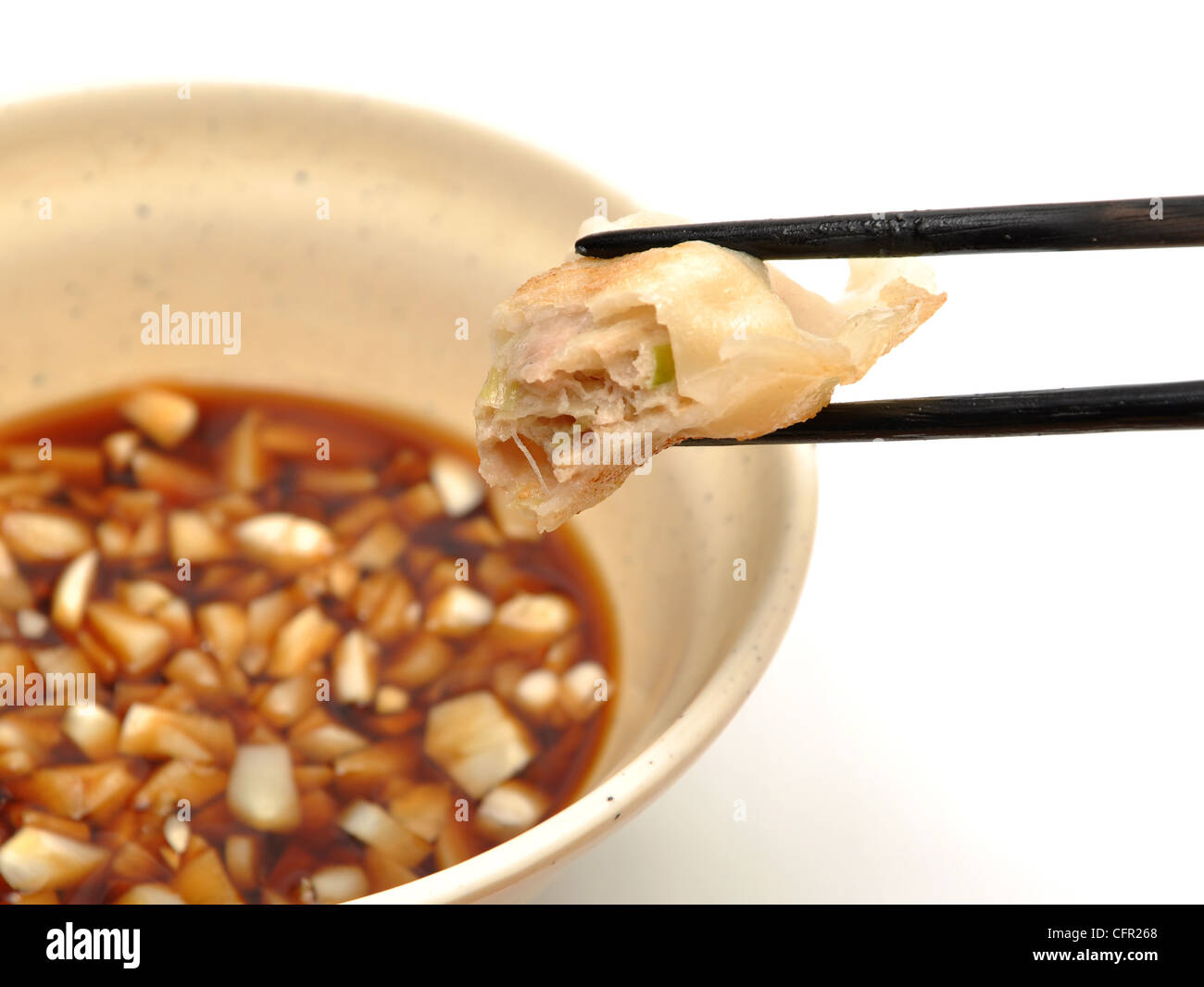 Eating fired chinese dumpling Stock Photo