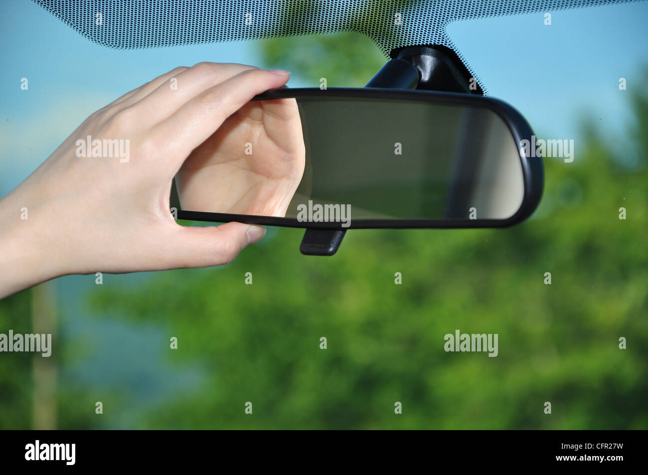 Adjusting rear view mirror Stock Photo Alamy