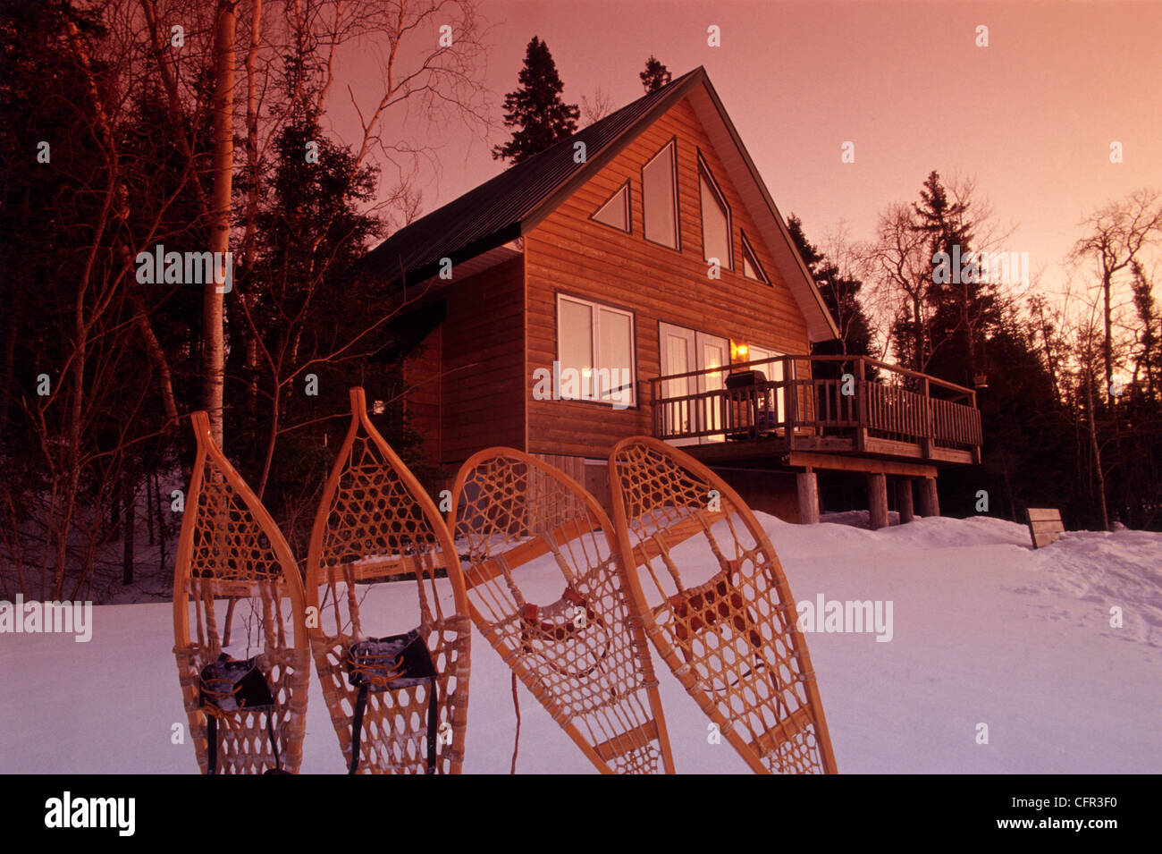 Snowshoes and Cottage, Whiteshell Provincial Park, Manitoba Stock Photo