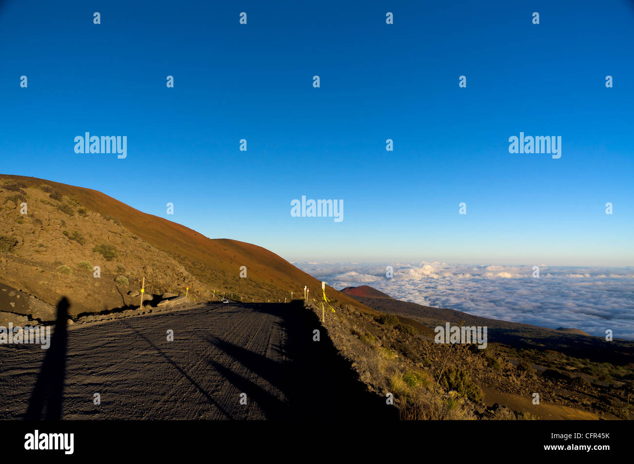 the gravel road at sunset to Mauna Kea Stock Photo Alamy