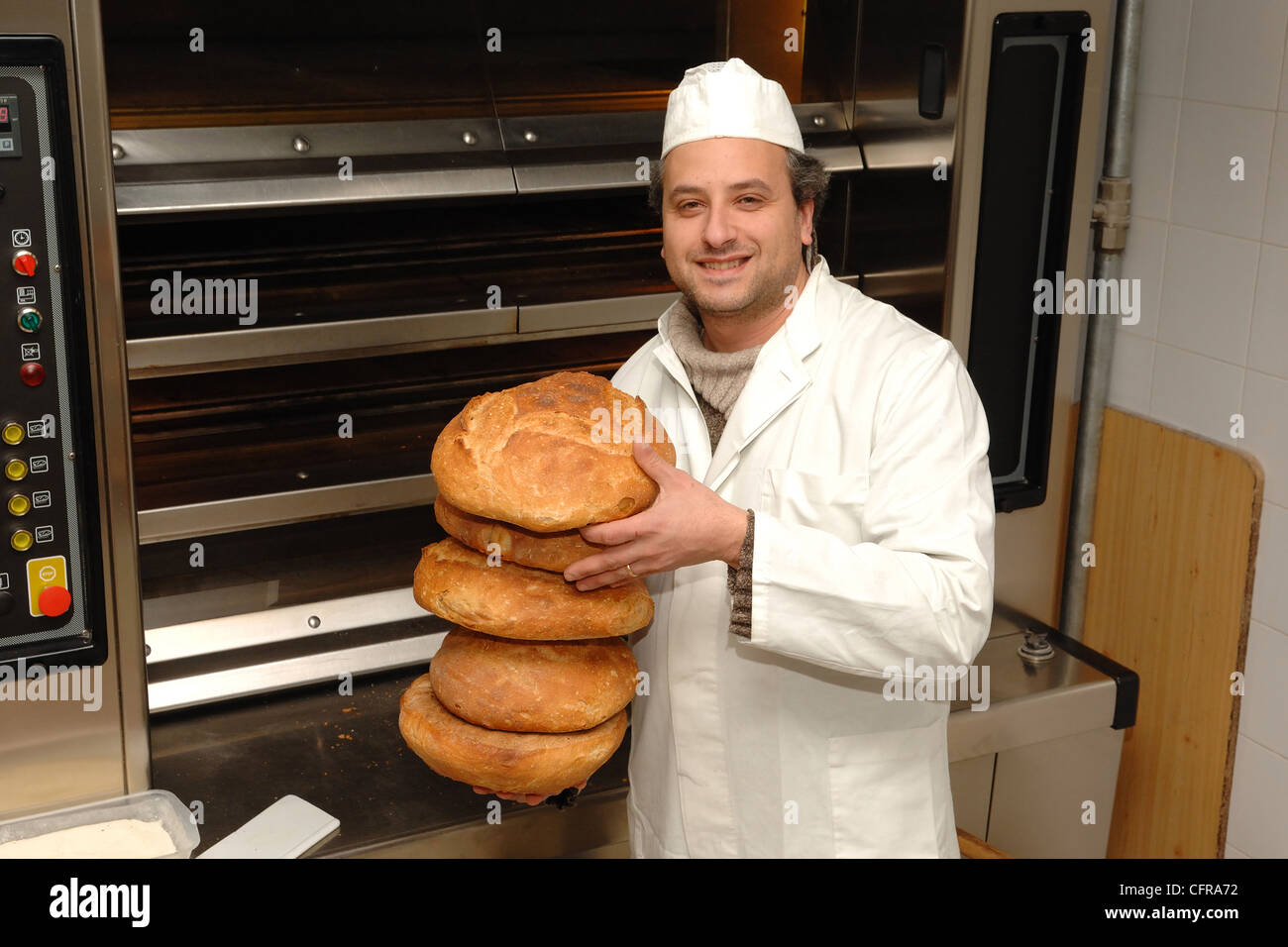 Italian baker with his bread, Basilicata, Italy Stock Photo