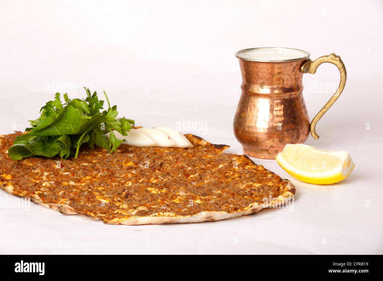 Delicious Turkish pizza lahmacun on isolated background Stock Photo