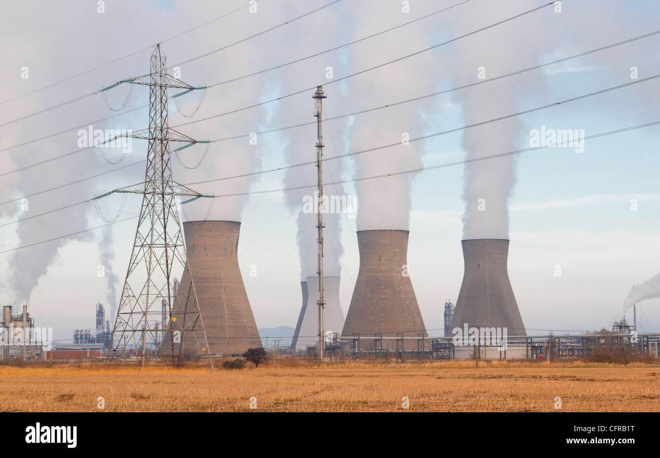 Pylon and cooling towers at Oil Refinery Stock Photo
