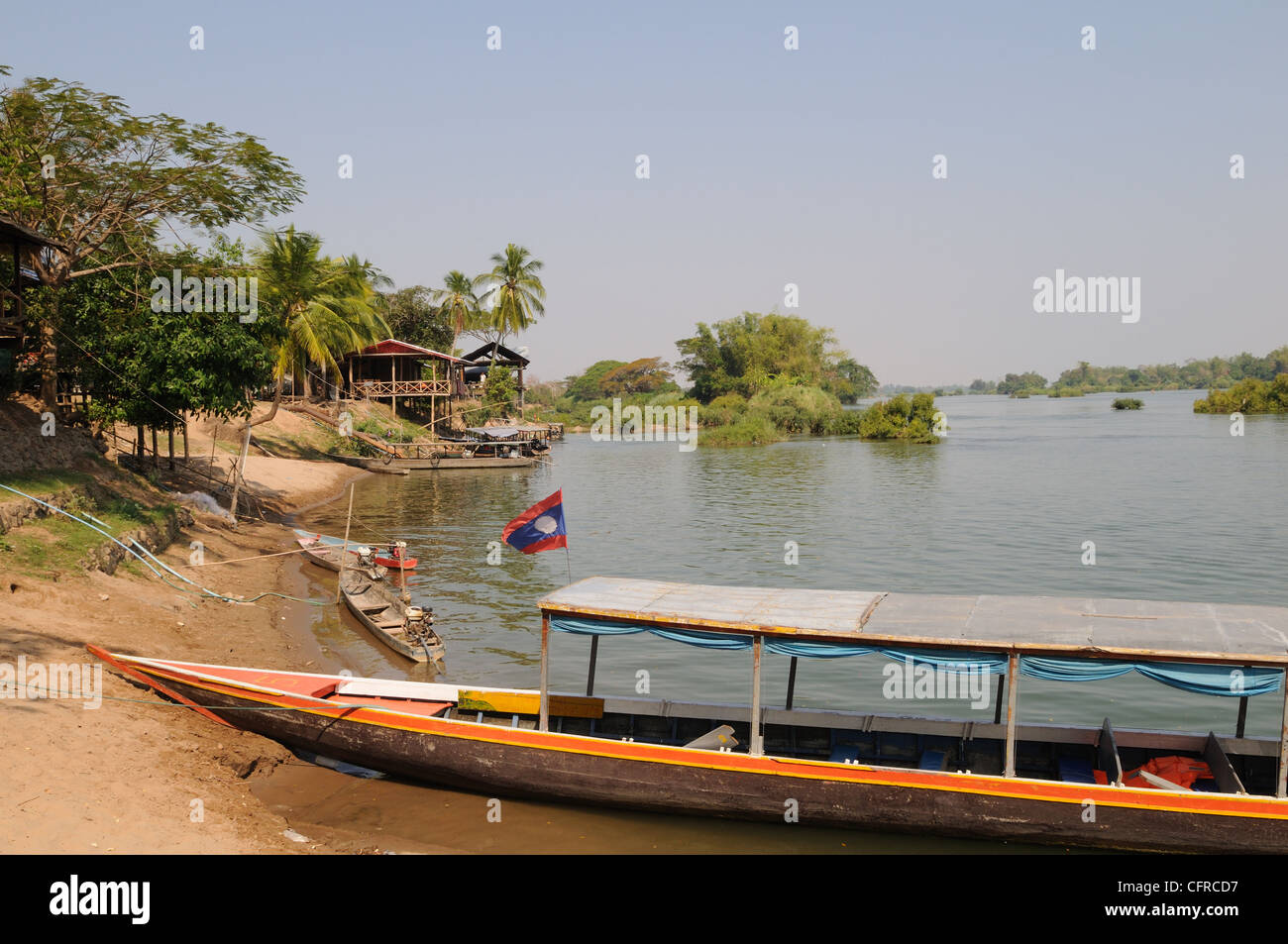 Longboat on the Mekong River at Don Det Village Si Phan Don Laos Stock Photo