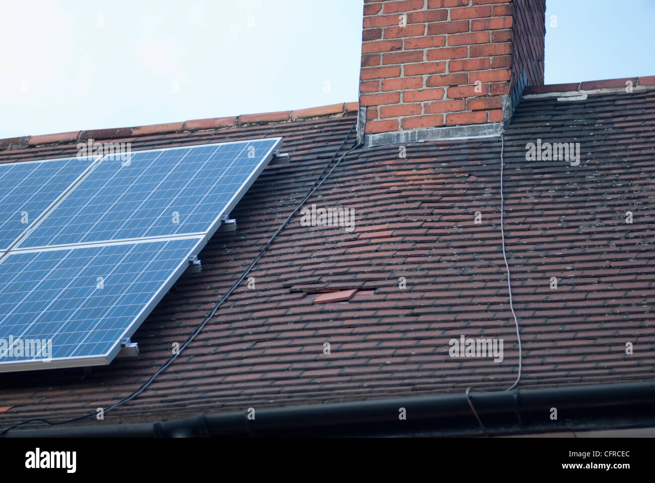 Damaged roof near solar panels Stock Photo Alamy