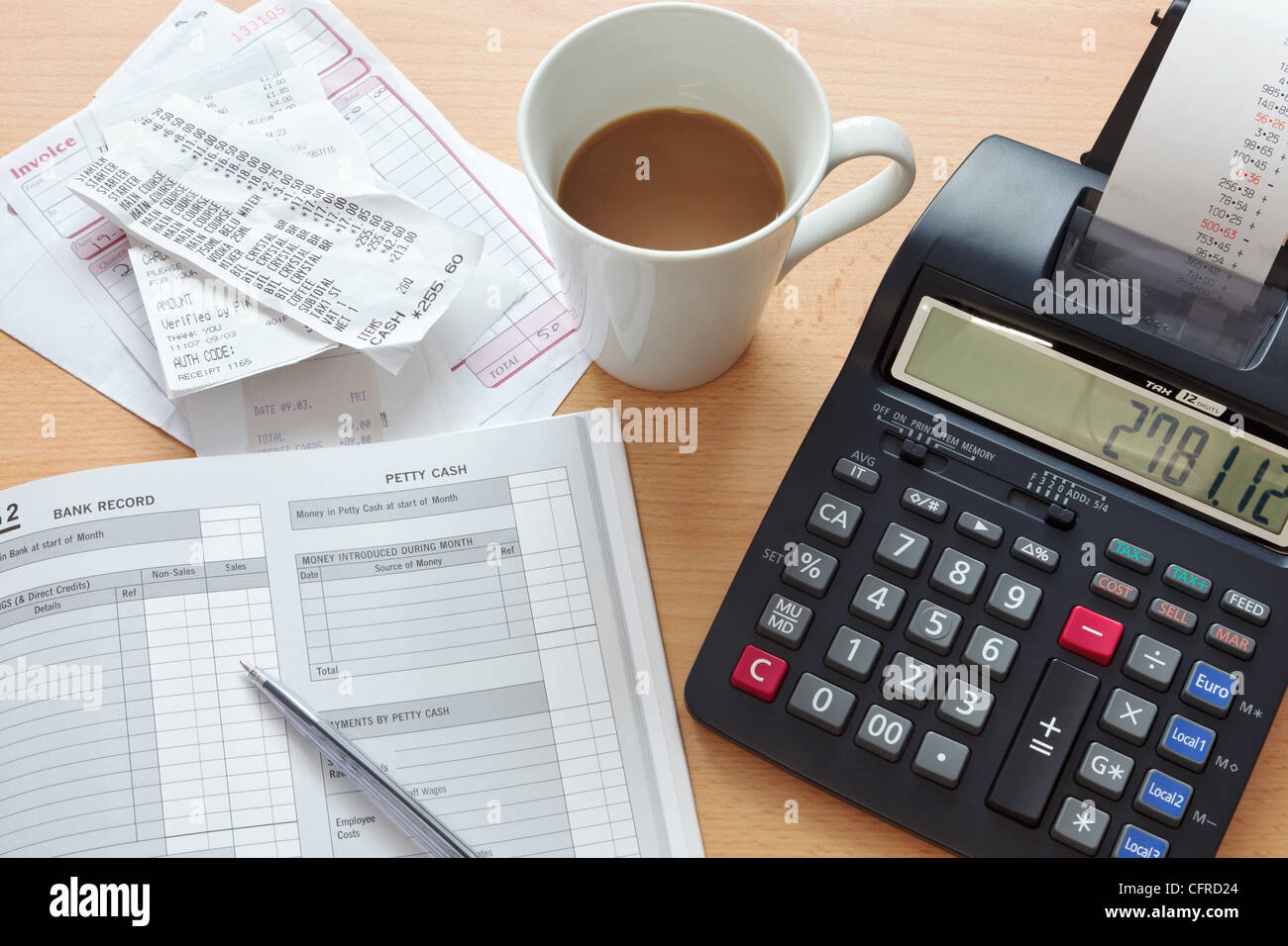 Still life bookkeeping photo of a sales ledger with a pile of receipts, invoices and a print calculator. Stock Photo