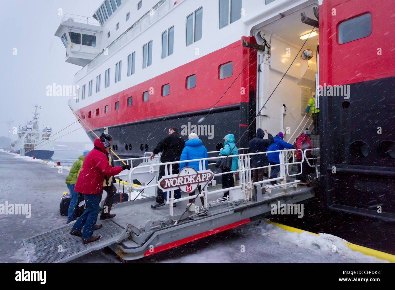 Nordkapp Hurtigruten cruise ship loading passengers for an arctic circle cruise trip Tromso harbour North Norway Europe Stock Photo