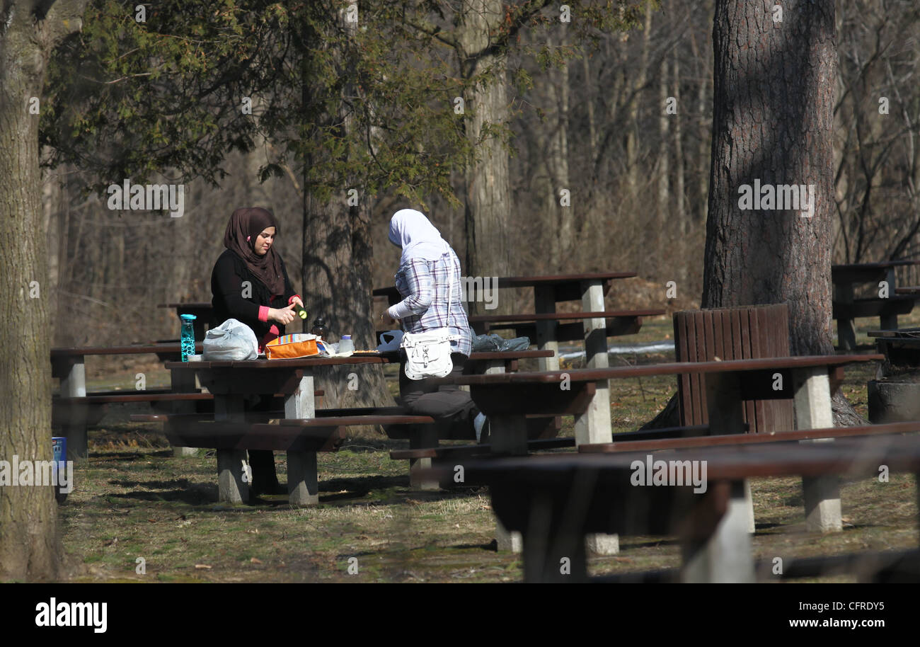 Two Muslim women having a picnic Stock Photo