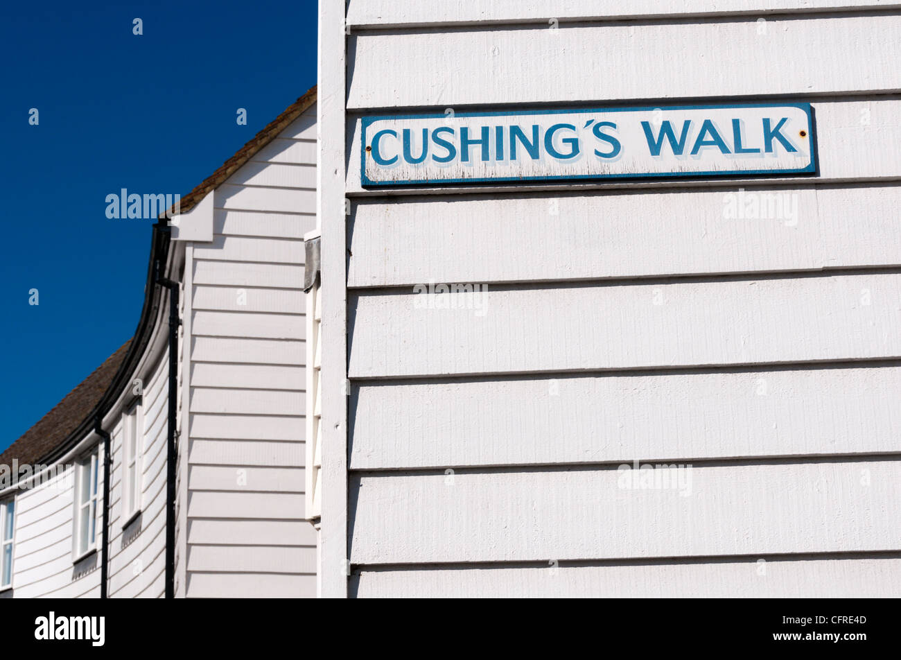 Street name sign for Cushing's Walk on a weatherboarded building in Whitstable, Kent. The actor Peter Cushing lived in the town. Stock Photo