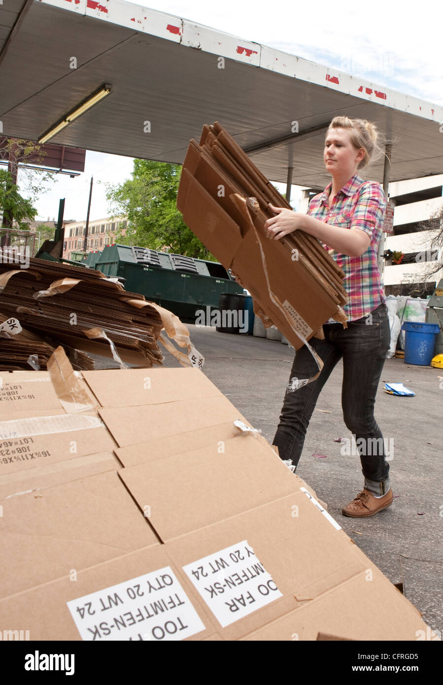 Young citizens bring in cardboard to a recycling dropoff and