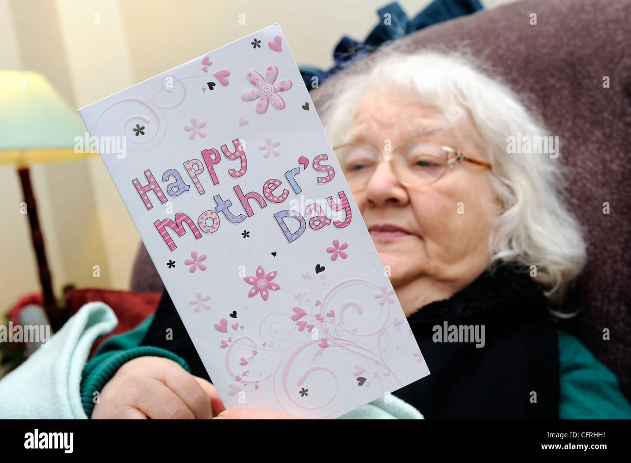 pensioner holding mothers day card england uk Stock Photo Alamy