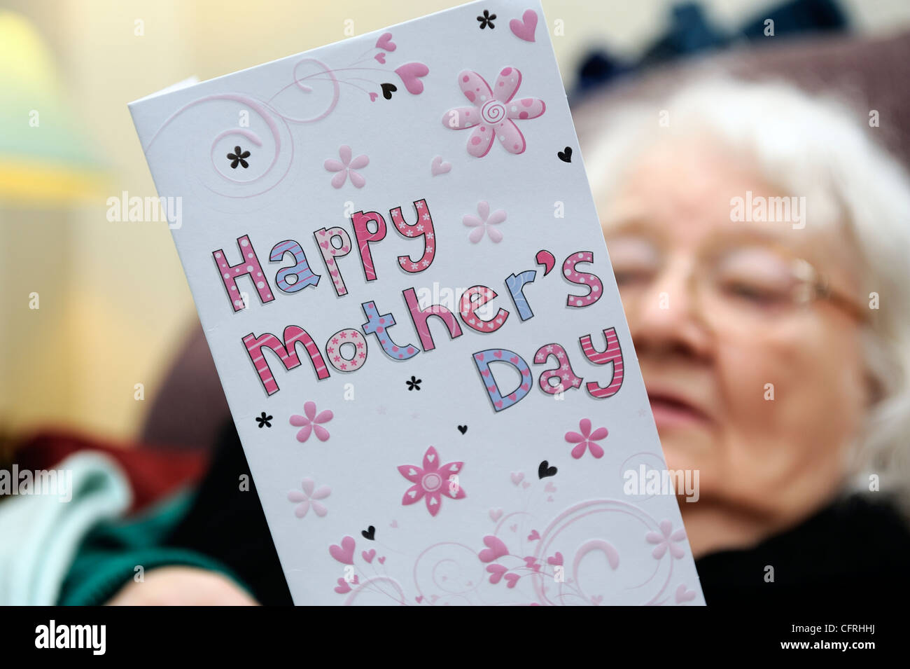 pensioner holding mothers day card england uk Stock Photo Alamy