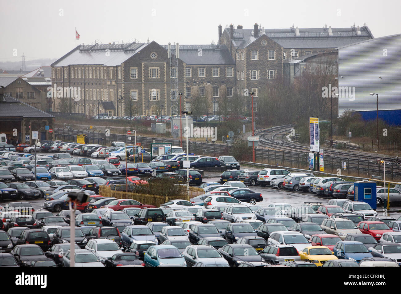 Large car park full of cars parked in front of the headquarters of English Heritage in Swindon, Wiltshire Stock Photo