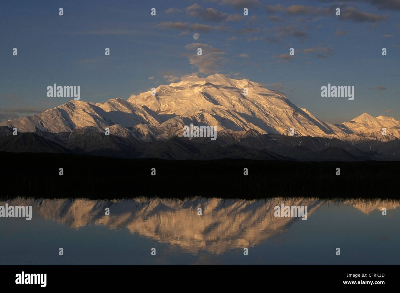 20,320 foot Mt McKinley reflects into a kettle hole pond at sunrise