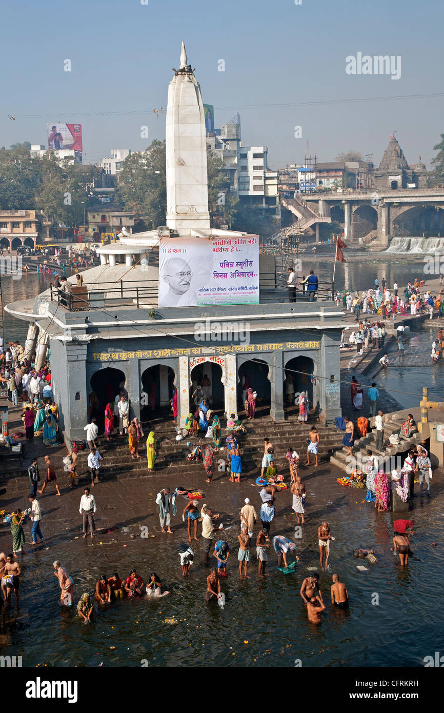 Hindu pilgrims bathing in the sacred waters of the Ram Kund. Godavari river. Nasik. India Stock Photo