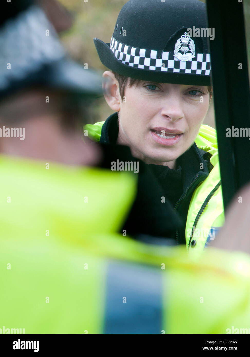 A female Police Officer from Lothian and Borders Police Force carrying out spot checks on the A1 Stock Photo