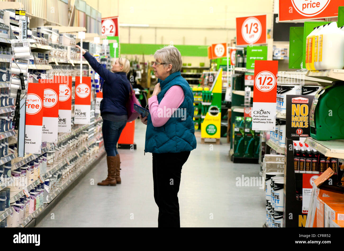 A woman buying discounted reduced price DIY goods in a Homebase store, UK Stock Photo