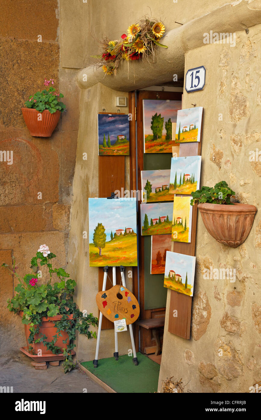 Small shope with artwork for sale on sidewalk, Montalcino, Italy, Tuscany Stock Photo