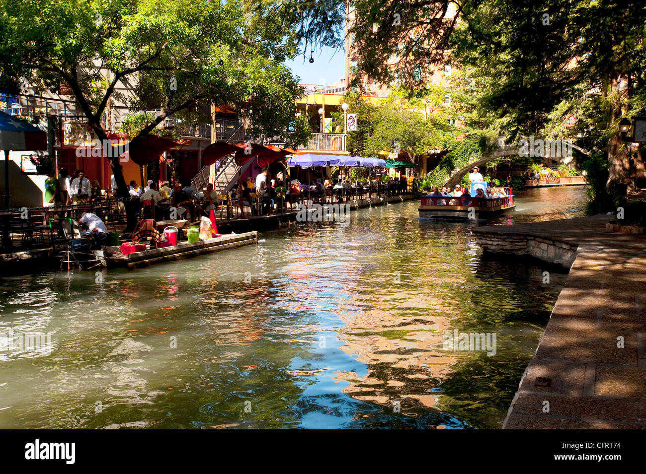 USA, Texas, San Antonio, Riverwalk, colorful river's edge cafe, tourists, gondola, Michelino's