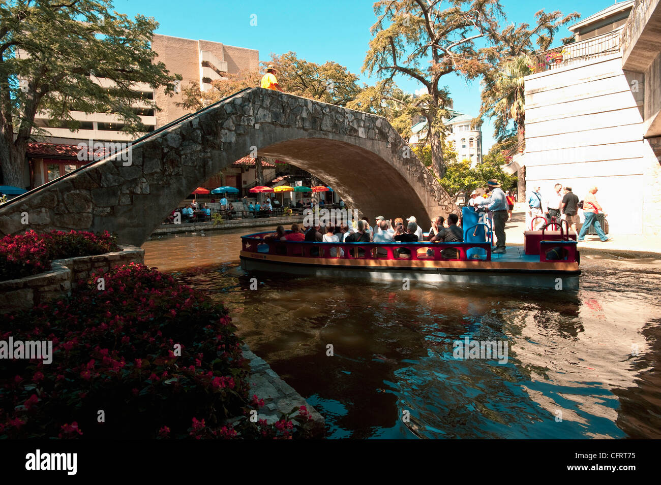 USA, Texas, San Antonio, Riverwalk, colorful river's edge cafe, umbrella tables, Casa Rio