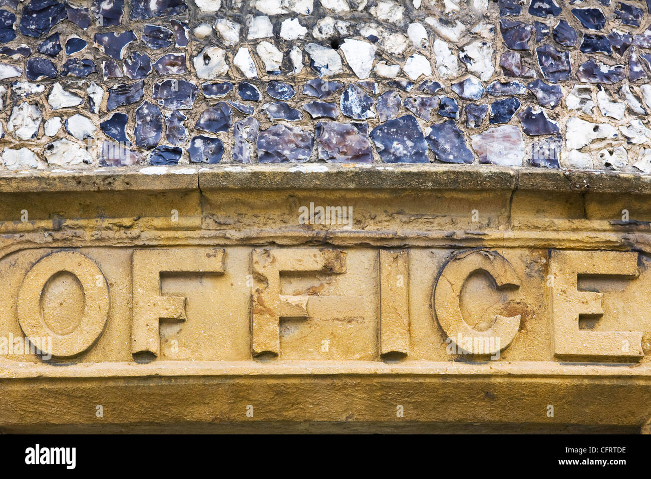 Office sign carved into a Cotswold Stone building, Stow on the Wold, Gloucestershire. Stock Photo