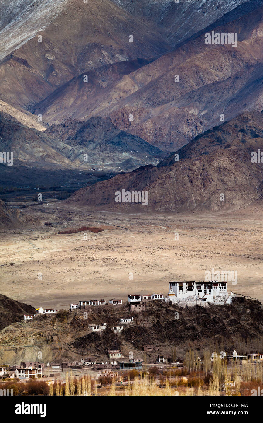 The Stakna monastery perched upon a small hill with the mountains of the Ladakh range looming in the background. Stock Photo
