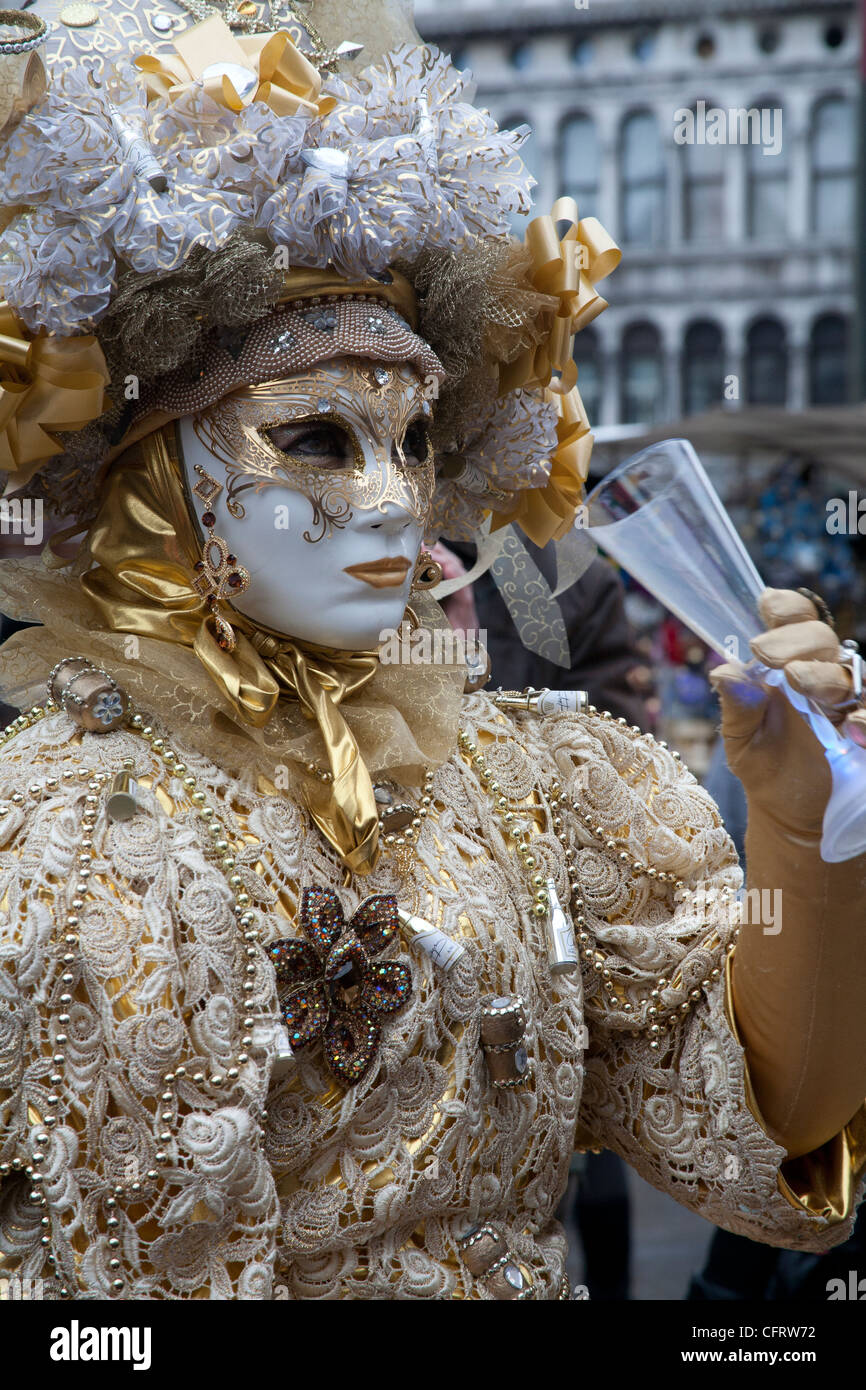 Person dressed up in gold carnival costume for the Carnival of Venice ...