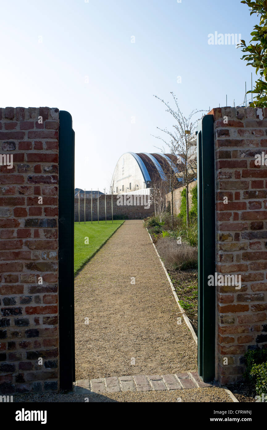 The Royal Opera House workshop building at Purfleet, Essex is viewed through a gateway in its grounds. Stock Photo