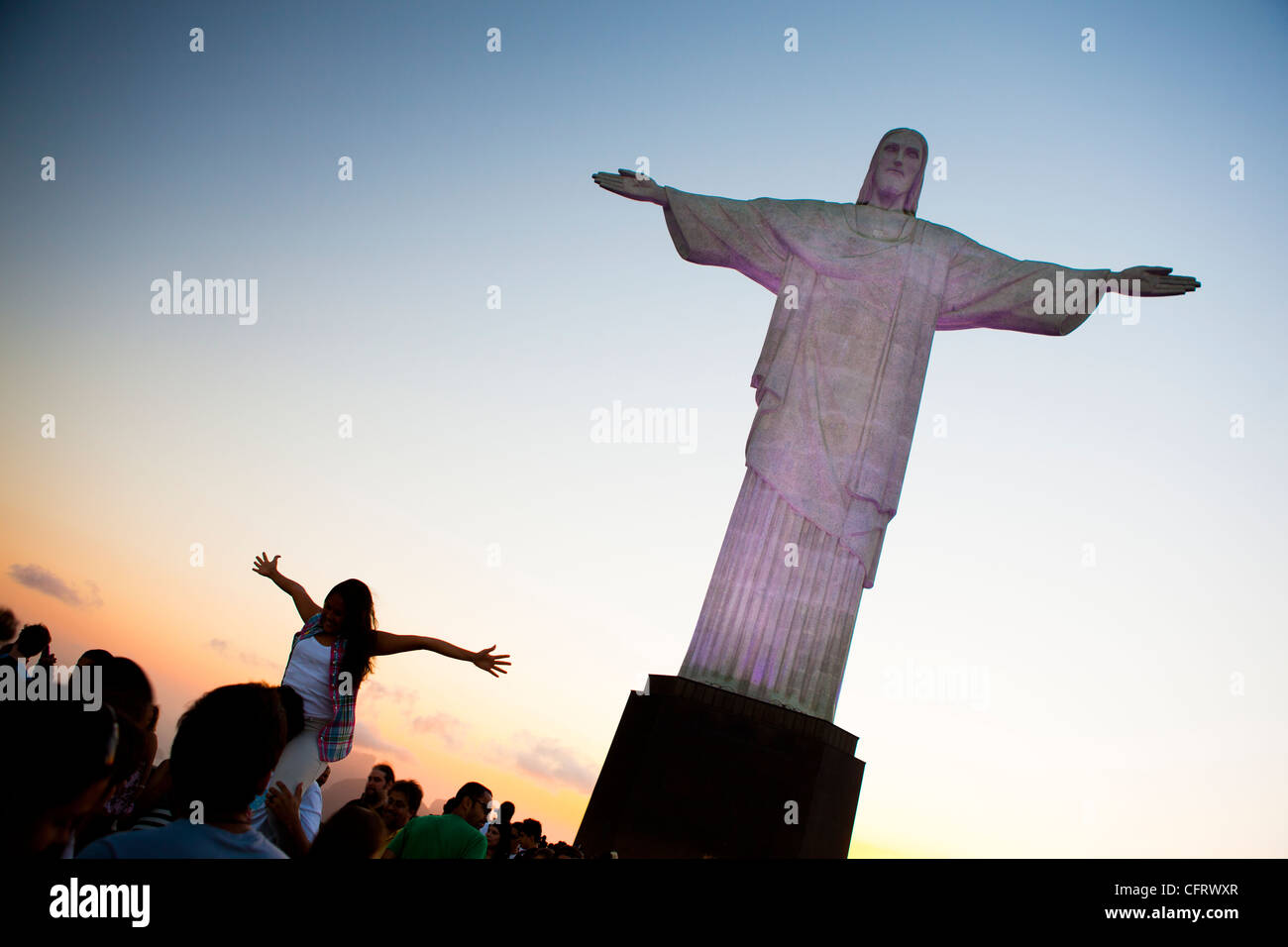 Tourists posing and taking pictures at Brazil most known landmark, Christ the Redeemer statue, Corcovado, Rio de Janeiro. Stock Photo