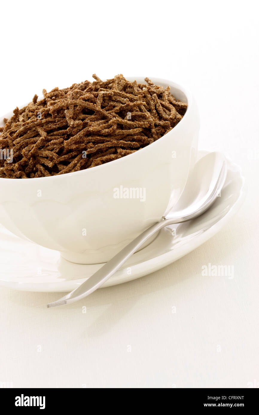 Delicious and nutritious cereal, orange juice and apple, high in bran, high in fiber, served in a beautiful French Cafe au Lait Stock Photo