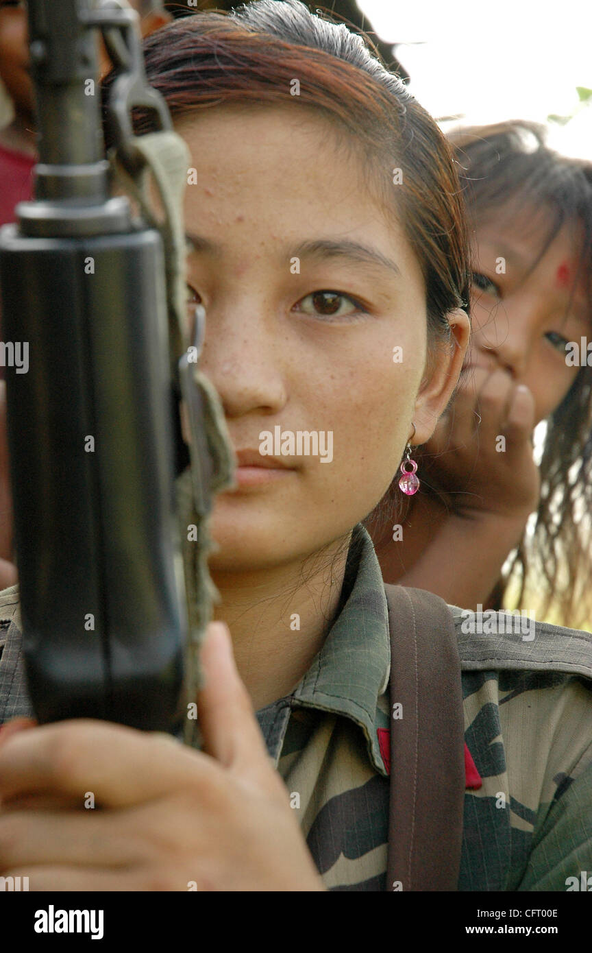 Nov 29 2006 Sarlahi Nepal A Village Girl Watches The Female Fighters Of Nepal S Maoist
