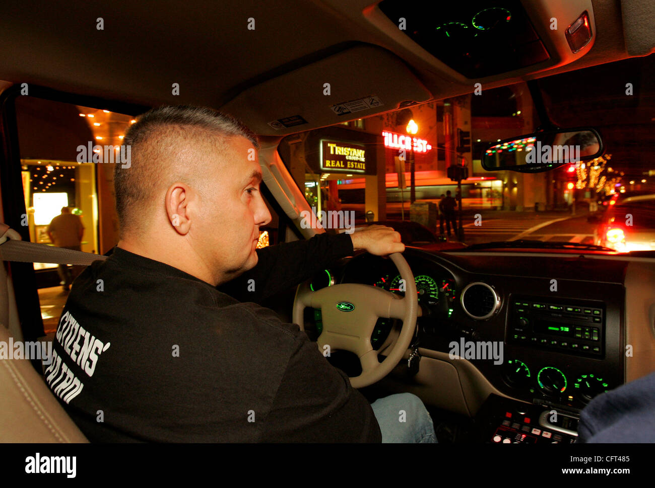 December 8, 2006, San Diego, California, USA The Stonewall Citizens patrol has been patrolling the North Park and Hillcrest areas at night due to the increase in crime. Here, BOB LEHMAN drives around Hillcrest with BEN GOMEZ, in passenger seat.  Mandatory Credit: Photo by K.C. Alfred/The San Diego U Stock Photo