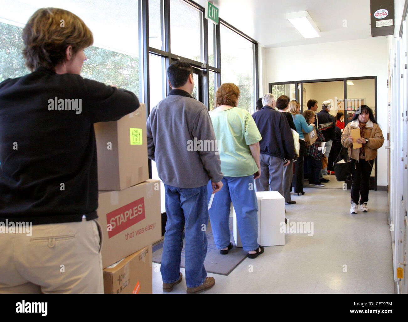 Customers wait in line to mail packages and letters at the Chabot Dr