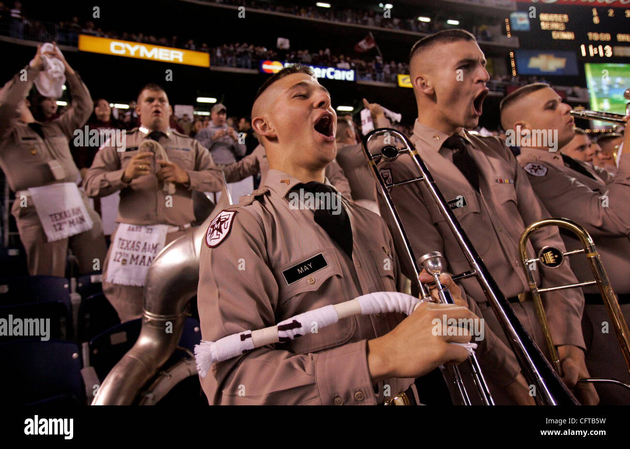 December 28, 2006. San Diego, California, USA    Texas A&M cadet corpsmen MATTHEW MAY (LEFT) and JAMES BLANKENSHIP celebrate the Aggies first touchdown during the first quarter of  the Pacific Life Holiday Bowl at Qualcomm Stadium.  Mandatory credit: photo by Nancee E. Lewis/San Diego Union-Tribune. Stock Photo