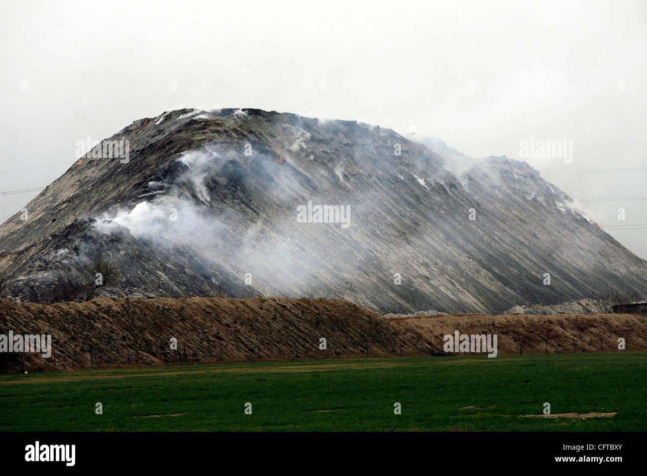 METRO The pile of mulch on fire in Helotes Wednesday was issuing smoke