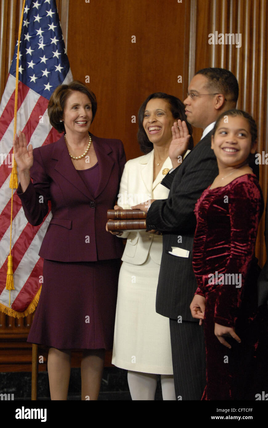 Jan 04, 2007 - Washington, DC, USA - KEITH ELLISON, the first Muslim to serve in the United States Congress, is sworn into office by Speaker of the House NANCY PELOSI. Ellison's family joined him for his swearing in ceremony. Stock Photo